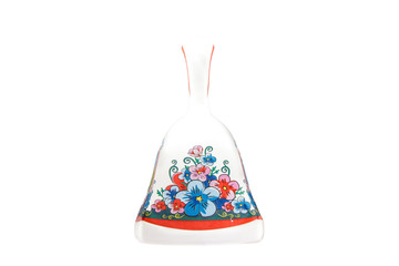 ceramic souvenir toy in the form of bell with beautiful color painting on isolated white background reflecting the national Russian culture
