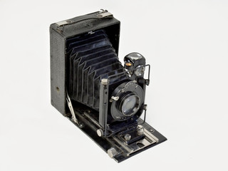 Vintage camera in black on a white background