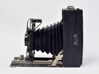 Vintage camera in black on a white background