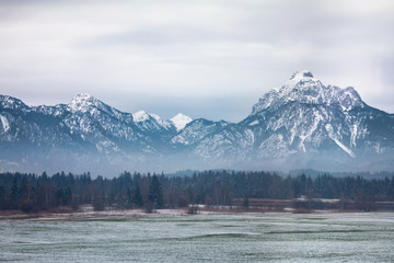 Beautiful winter wonderland mountain scenery with Alps in the background