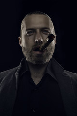Badass character man with cigar on black, shallow depth of field