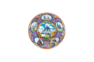 ceramic souvenir toy in the form of plate with color painting on isolated white background reflecting the national Russian culture with the inscription in Russian: Christmas Cathedral of Suzdal