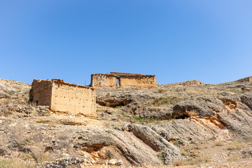 Fototapeta na wymiar shepherds shelters on a hill - suburb of Jaraba town, province of Zaragoza, Aragon, Spain