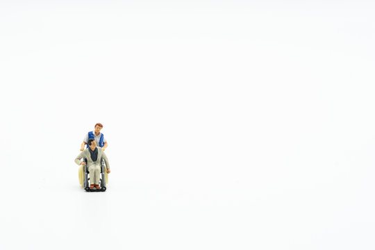 Medical and health care concept, patient sitting on wheel chair isolated on white background.