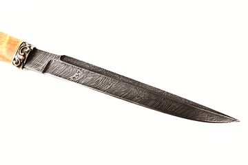 hunting knife of Damascus steel on a white background