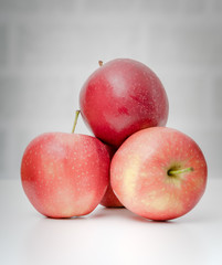Ripe fresh red apples on table