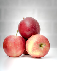Ripe fresh red apples on table