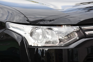 shiny headlights on a blue car