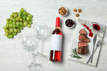 Fototapeta na wymiar Flat lay composition with wine and food on white background. Space for design