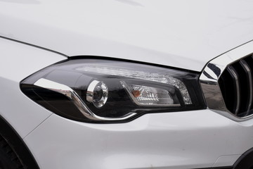 shiny headlights on a white car