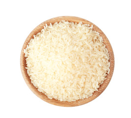 Bowl with uncooked parboiled rice on white background, top view