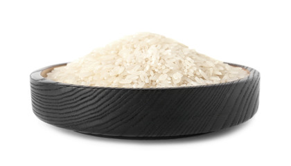 Plate with uncooked rice on white background