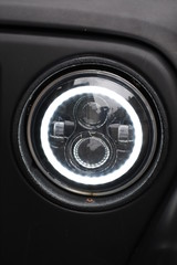 shiny headlights on a white car