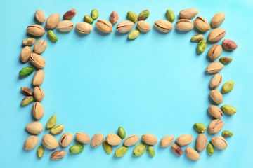 Frame made of organic pistachio nuts, flat lay. Space for text