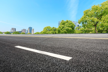 Fototapeta premium Urban road and modern commercial buildings in Shanghai