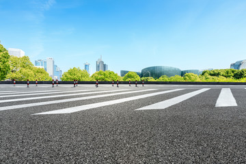 City zebra crossing road and modern commercial buildings in Shanghai