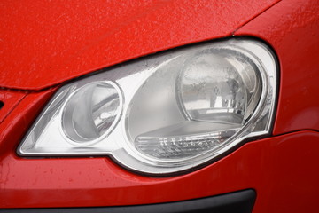  Frozen car headlight,Freezing rain ice coated car. 