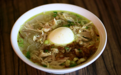 Soto ayam or Indonesian Chicken Soup with boiled egg.