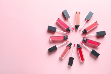 Composition of lipsticks on color background, flat lay. Space for text