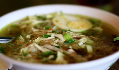 Soto ayam or Indonesian Chicken Soup with boiled egg.
