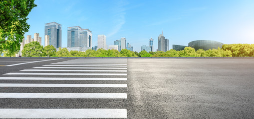 City zebra crossing road and modern commercial buildings in Shanghai