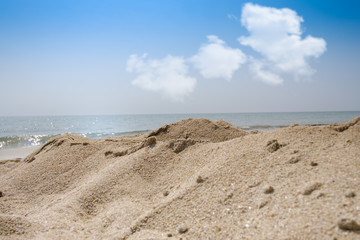 Beach sand with sea and sky background and summer day