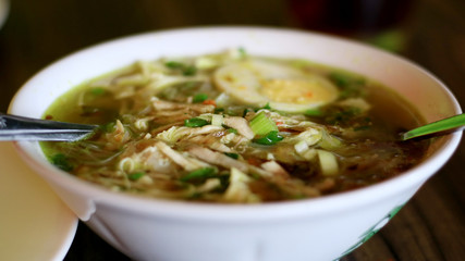 Soto ayam or Indonesian Chicken Soup with boiled egg.