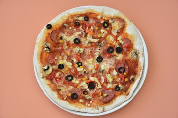 pizza with olives and cheese on lightcoral