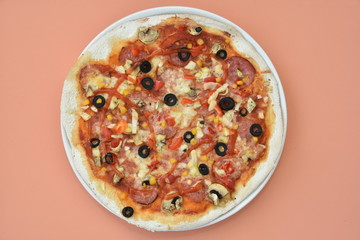 pizza with olives and cheese on lightcoral