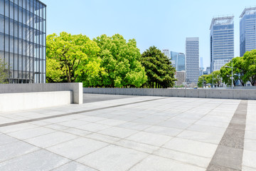 City square floor and modern commercial building in Shanghai - obrazy, fototapety, plakaty