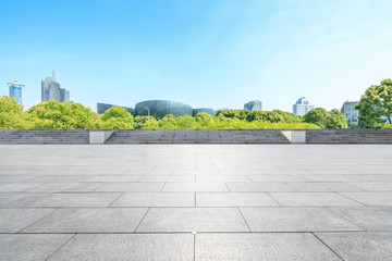 Fototapeta premium Empty square floor and modern commercial building in Shanghai