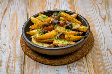 Fried potatoes with mushrooms