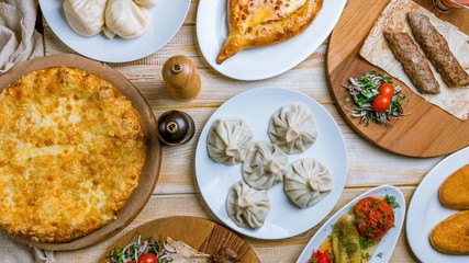 Georgian cuisine foodset from khachapuri, khinkali, pkhali, dolma, satsivi top view
