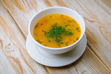 Chicken soup bouillon in a plate
