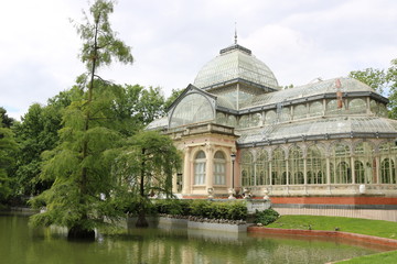 Fototapeta na wymiar Crystal Palace or Palacio de Cristalis in the Buen Retiro Park, one of the largest parks of Madrid city, Spain. Madrid is the capital of Spain