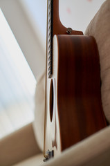 Acoustic guitar on a couch