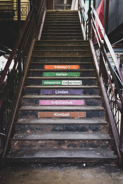 stairs leading to elevated train tracks in chicago