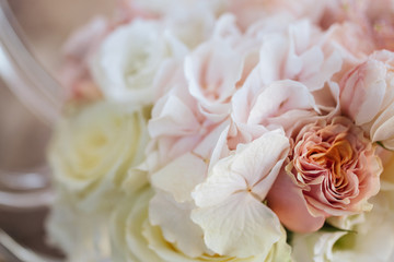 Wedding flowers, bridal bouquet closeup. Decoration made of roses, peonies and decorative plants, close-up, selective focus, nobody, objects