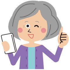 スマホを操作に成功するシニアのかわいい女性