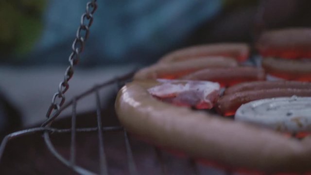 Close up of bbq and glow on a pivoting grill 