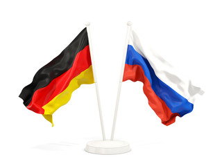 Two waving flags of Germany and russia