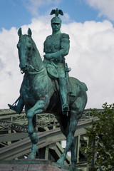 Fototapeta na wymiar Wilhelm II horse statue in Cologne ,Koln, Germany , 2017,The bridge in the back