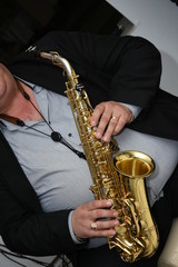 Naklejka premium Man plays the saxophone