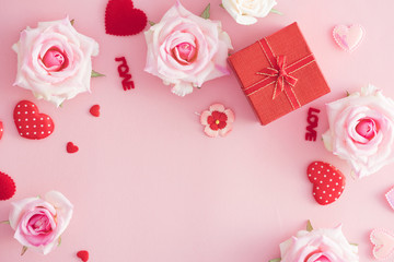 Valentine Day gift box with red hearts and roses on pink background