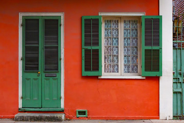 Fototapeta na wymiar Red House with Green Shutters New Orleans