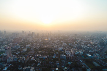 Naklejka na ściany i meble Sunset light on Bangkok city building