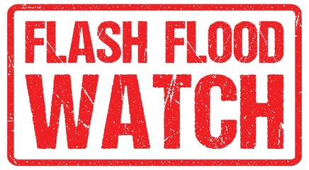 A road warning sign against a stormy sky with words Flash Flood Area, Flood Warning