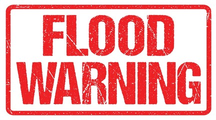 A road warning sign against a stormy sky with words Flash Flood Area, Flood Warning