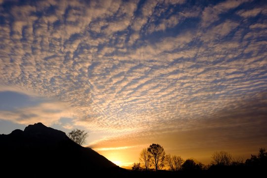 Sheep clouds (Altocumulus) at dusk, on the left the silhouette of the Untersberg, Salzburg, Austria, Europe