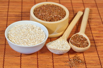 Flax seeds and oat bran on bamboo napkin